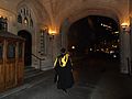 Graduand walking along the courtyard of the Maughan Library