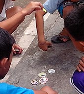 Children playing Pogs Kids playing pogs.jpeg