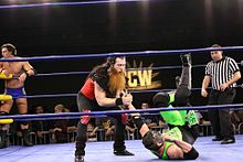 TCW Star Kincaid applies a wristlock to "Hurricane" Shane Helms Kincaid Wristlock On Helms.jpg