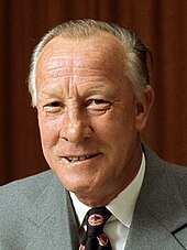 Minister for Defence Lance Barnard in 1973. Barnard criticised the DDL project when he was the Shadow Minister for Defence, and cancelled it on the advice of the navy after the Australian Labor Party came to power. Lance Barnard 1973 (1).jpg