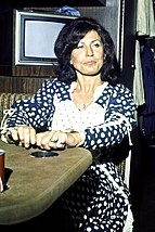 Loretta Lynn became the first female artist to win the award Loretta Lynn 1975 on tour.jpg