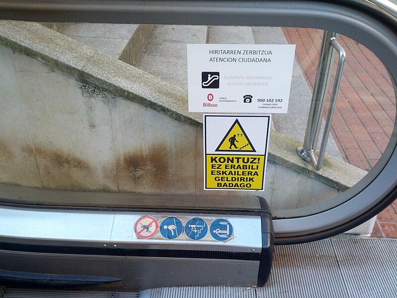 File:Maintenance and warning stickers on public escalator (18439456613).jpg