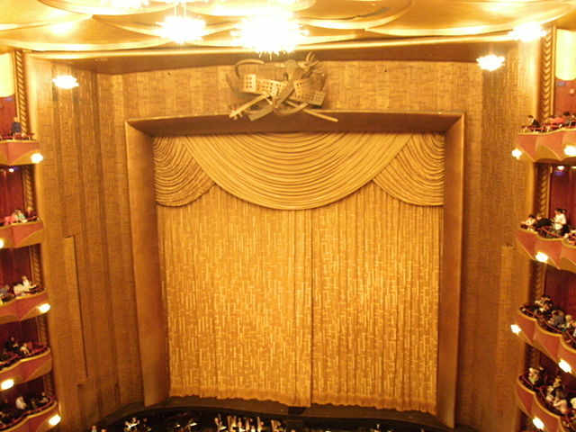 Gold curtain, a gift of the Metropolitan Opera Club, in the auditorium
