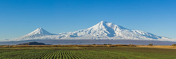 "Mount Ararat and the Araratian plain seen early morning from near the city of Artashat in Armenia. On the center left can be seen the historic Khor Virap monastery. (stitched from two images)"