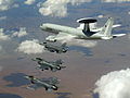 NATO E-3 AWACS flying with three American Air Force F-16 Fighting Falcon fighter aircraft in a NATO exercise