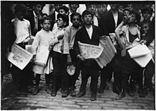 Young Newsboy distributes newspapers on the street in the late 1800s Newsboys and newsgirl. Getting afternoon papers. New York City. - NARA - 523329.jpg