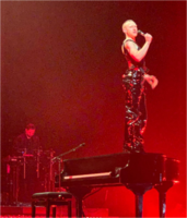 Alexander performing "It's a Sin" during the Night Call Tour at the AO Arena in May 2022. Night Call Tour - It's a Sin.png