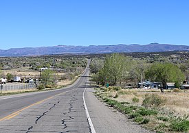 The Uncompahgre Plateau (the highest land in the back) rising above Nucla, Colorado. Nucla, Colorado area.JPG