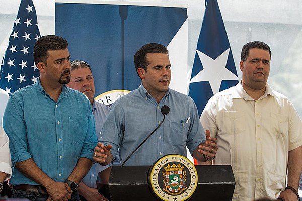 Rosselló (center) speaks in Utuado, Puerto Rico in March 2018