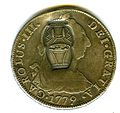 Anverso de moneda de 8 reales (plata) de Carlos III de 1779 resellada en Ras al Jaima.