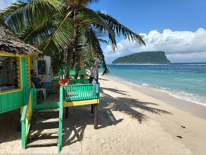 File:Reading on fale deck Taufua Beach Fales Samoa.jpg