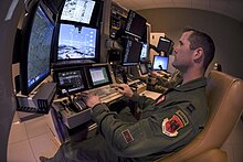 Capt. Daniel, 867th Attack Squadron MQ-9 Reaper pilot and Ranger, trains with a sensor operator in a flight simulator at Creech Air Force Base, Nevada, Mar. 11, 2020. Daniel accomplished the rare task of earning his Ranger tab when he completed Army Ranger School during the summer of 2019. Reaper Airman fulfills dream of earning Ranger tab Image 1 of 5.jpg