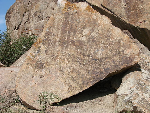 Clear script on rocks near Almaty