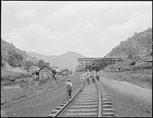 Kentucky students walking along the railroad, 4 September 1946 School children walk down the railroad tracks to their homes and lunches. Kentucky Straight Creek Coal Company, Belva... - NARA - 541234.jpg