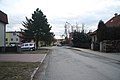 Čeština: Jižní pohled do ulice J. A. Komenského v Okříškách, okr. Třebíč. English: South view of J. A. Komenského street in Okříšky, Třebíč District.