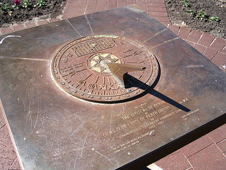 Southern-hemisphere sundial in Perth, Australia. Magnify to see that the hour marks run anticlockwise. Note graph above the gnomon of the Equation of Time, needed to correct sundial readings.