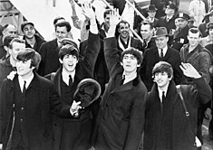 The Beatles (with Harrison third from left) in 1964, during the height of Beatlemania The Beatles arrive at JFK Airport.jpg