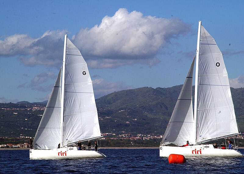 File:US Navy 031209-N-3503S-002 The U.S. Sailing Team jockeys for position and tries to find the best wind during the 6th race of the 3rd World Military Games sailing competition.jpg