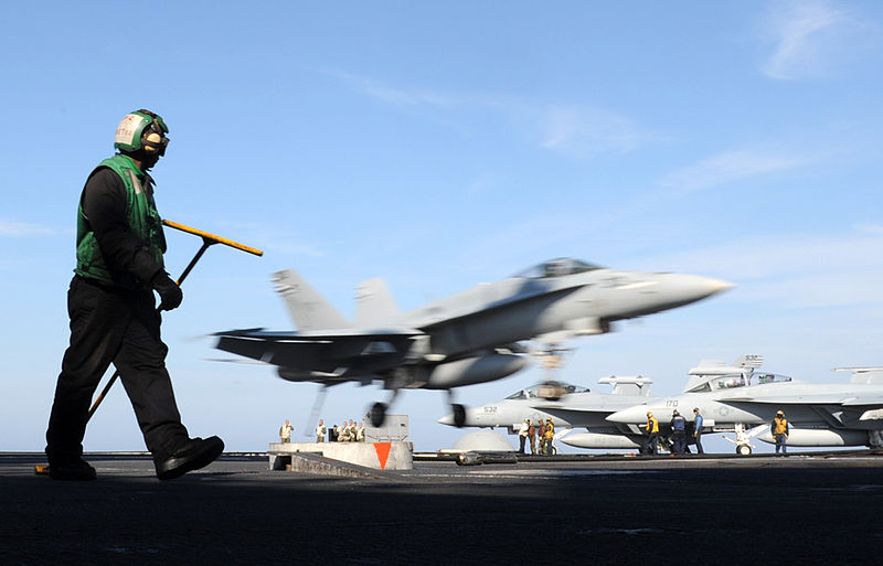 File:US Navy 120126-N-VA840-014 Aviation Boatswain's Mate (Equipment) 3rd Class John Bennett prepares to reset the arresting gear as an F-A-18F Super Ho.jpg