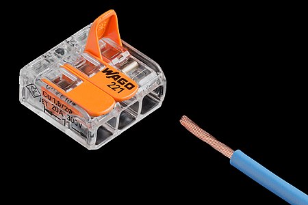 3-terminal splicing connector for stranded and solid wires alongside a stranded wire ready for insertion