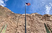 American flag between the statues