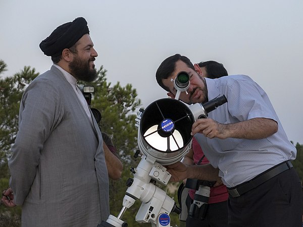 Muslim clerics observe the moon.