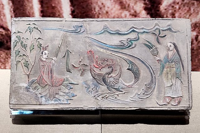 Man playing sheng to a phoenix, Dengzhou painted stone-relief [zh], Liu Song dynasty.
