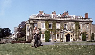 Percy Seymour, 18th Duke of Somerset (1910-1984) in front of his seat, Bradley House; All Saints' Church is visible at left 18th Duke of Somerset 4 Allan Warren.jpg