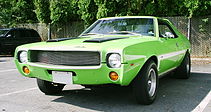 Shows front view of a neon green 1969 