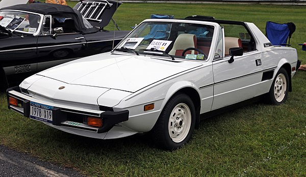 The Fiat X1/9 was designed around the all-new front-wheel drive Fiat 128, but used these parts in a radical way, moving the entire transverse drive tr