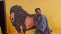 A Dagomba man with a molded image of a lion in Northern Ghana