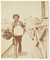 A chimney sweep (?) walking across Pyrmont Bridge Sydney, ca. 1885-1890 - photographed by Arthur K. Syer (5775144524).jpg