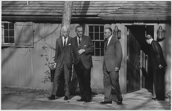 Lyndon B. Johnson with Ellsworth Bunker and W. Averell Harriman exiting Aspen cabin, April 9, 1968