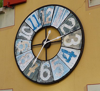 A wall clock in the village of Aranno, Ticino, Switzerland