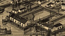 Ballast Island as depicted in an 1884 map of Seattle, shown enclosed by the OIC's Ocean Dock and City Dock Ballast Island (cropped from Birds Eye View of Seattle).jpeg