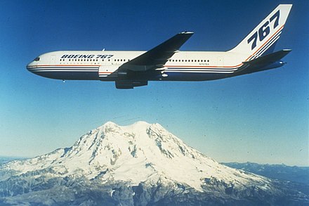 The first 767-200 built, N767BA, in flight near Mount Rainier in the 1980s