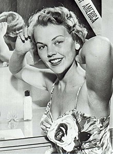 Johnson combing hair before the first day of the Miss Universe 1955 pageant Carlene Johnson combing hair (cropped).jpg