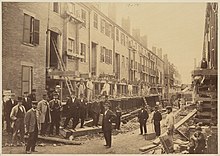 Houses on south side of Fayette Street, west of Church Street, being raised in 1868. Church St District Boston Fayette St Facing West, South Side, Being Raised 1868.jpg