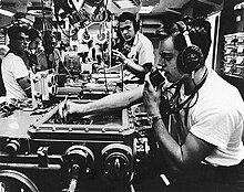 The crew of Canberra plotting target data Crewmen in the Main Battery Plot of USS Canberra (CAG-2) off Vietnam, in March 1967 (USN 1142153).jpg