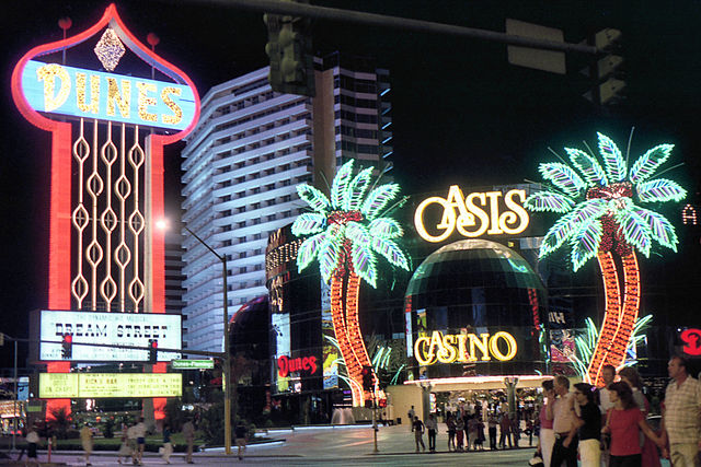 Dunes sign and Oasis Casino, 1983