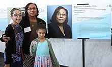 Edwards with her granddaughters at the 2019 NIH Black History Month Exhibition. Emmeline Edwards family.jpg