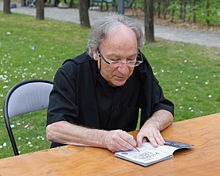 Ernest Pignon-Ernest, in autograph session at the Maison des Arts ('House of Arts') in Malakoff, Hauts-de-Seine, France, in March 2014. Ernest Pignon-Ernest dedicace Malakoff 2014.jpg