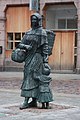 Statue of a fishwife carrying a creel and basket