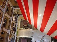 Looking down the northwest atrium with the edge of the hanging American flag in Marshall Field's