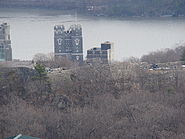 Ft. Putnam viewed from Redoubt Four. The Cadet Chapel and Taylor Hall towers and Hudson River beyond the fort are actually hundreds of yards beyond