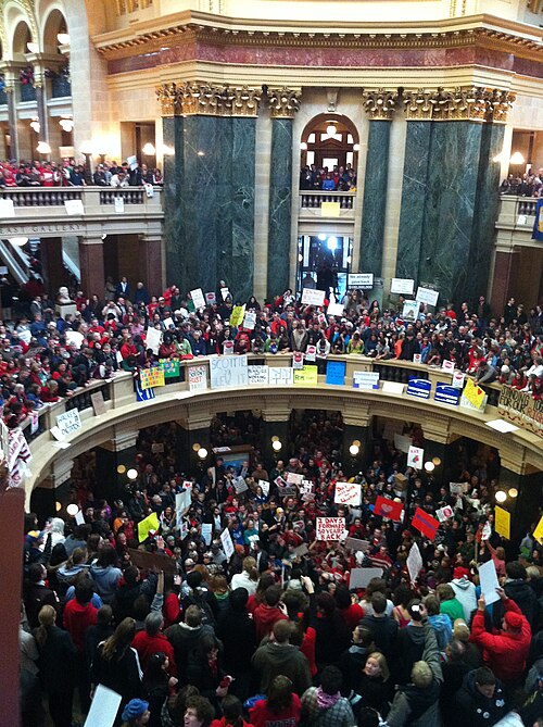 Thousands gather inside Madison Wisconsin's Capitol rotunda to protest Governor Walker's proposed bill.
