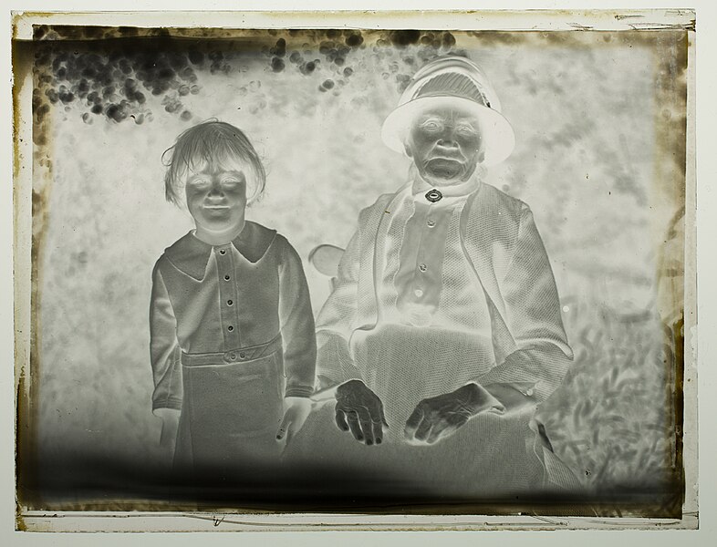 File:Half-length portrait of an old woman and young child in front of bushes (AM 78169-2).jpg