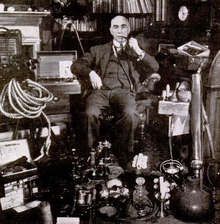 Harry Price pictured with assorted pieces of his "ghost hunting" equipment Harry Price ghost hunter (cropped).png