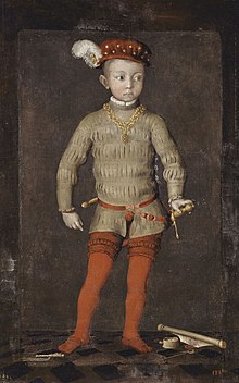 Portrait en couleur d'un enfant costumé avec une épée.