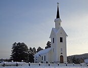 Kårböle kyrka i Kårböle, Ljusdals kommun i reveterat trä uppfördes 1869-70.